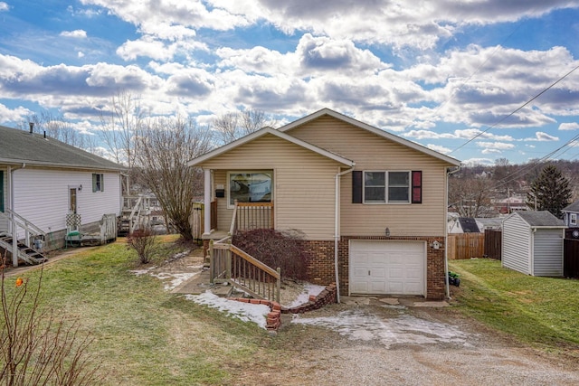 view of front of home featuring a garage and a front yard