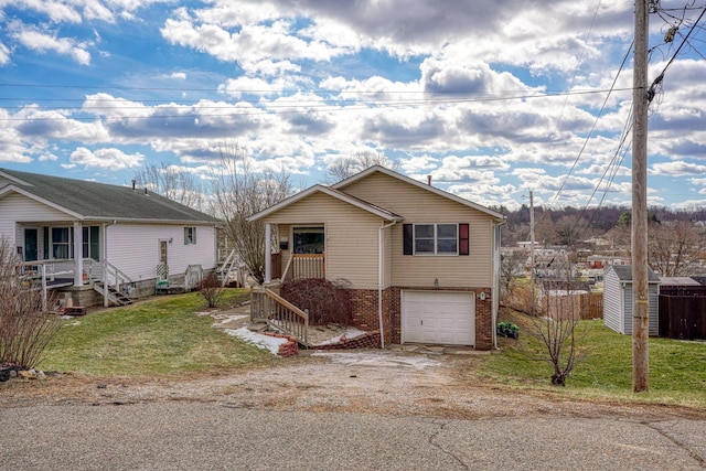 view of front facade with a garage and a front yard