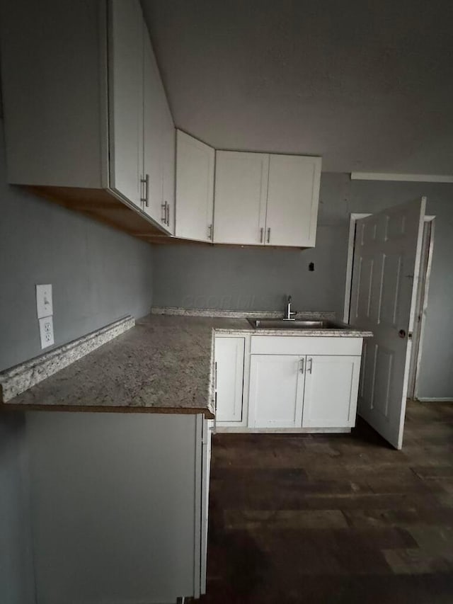 kitchen with sink and white cabinets