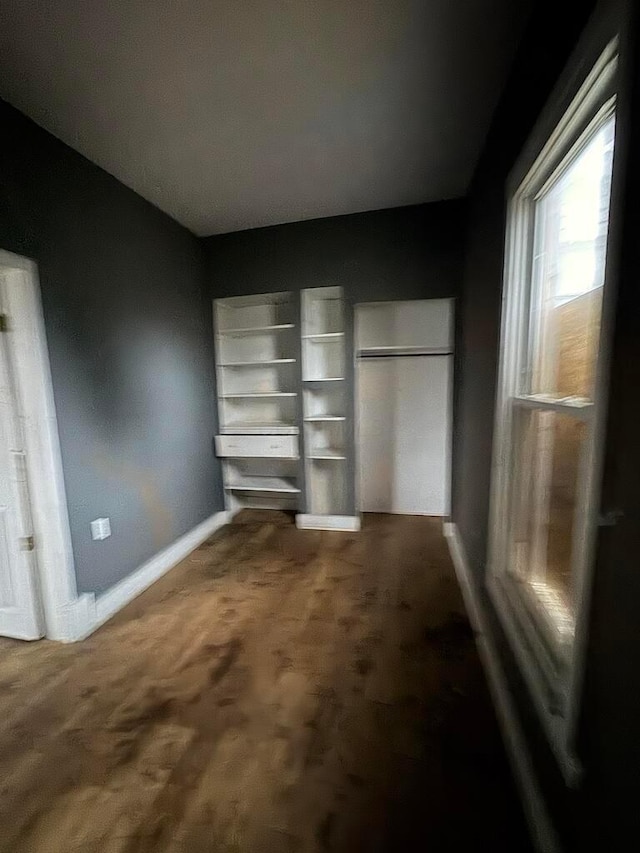 unfurnished bedroom featuring carpet flooring and a closet