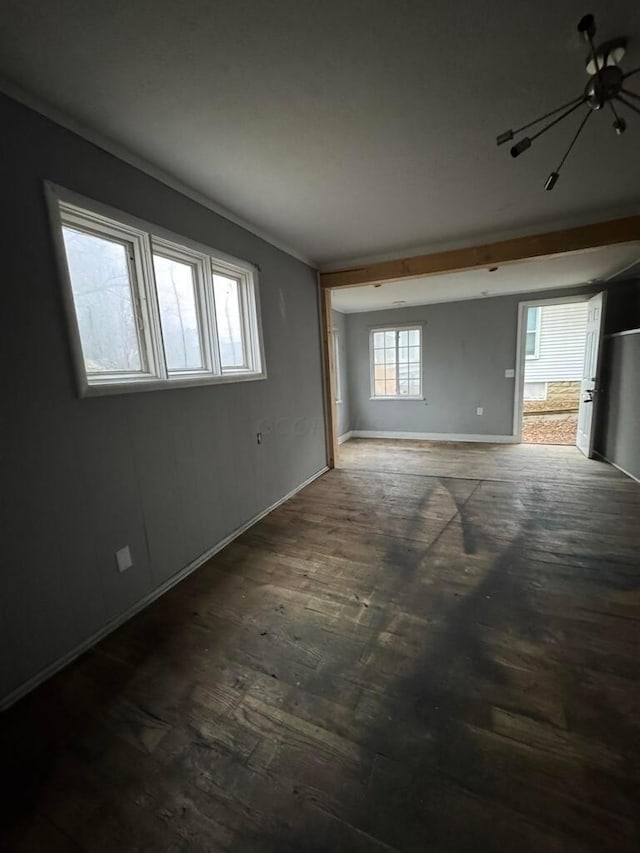 spare room with dark wood-type flooring