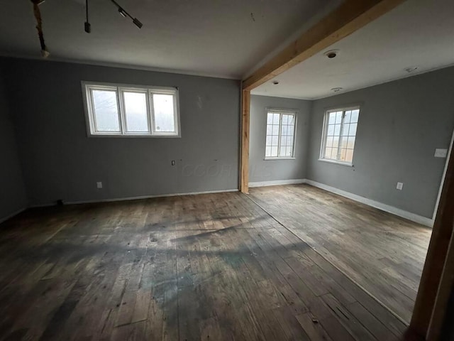 empty room featuring dark wood-type flooring