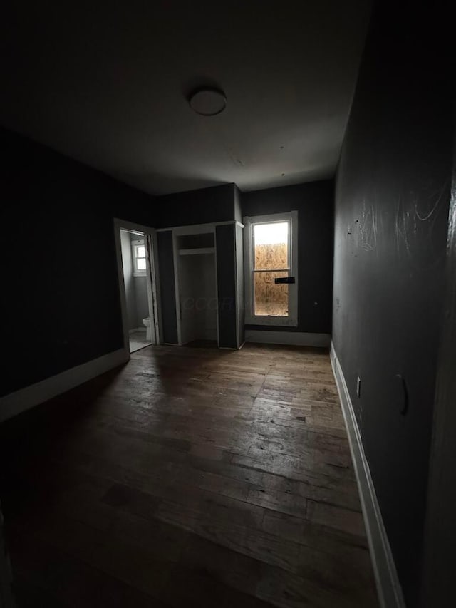 unfurnished room with hardwood / wood-style floors