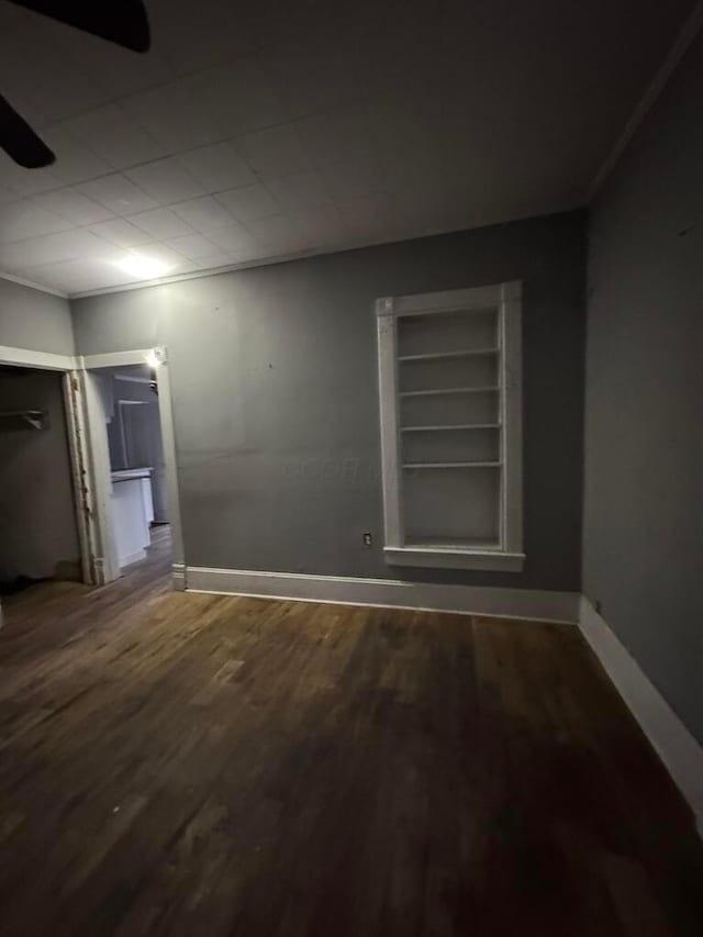 empty room with wood-type flooring