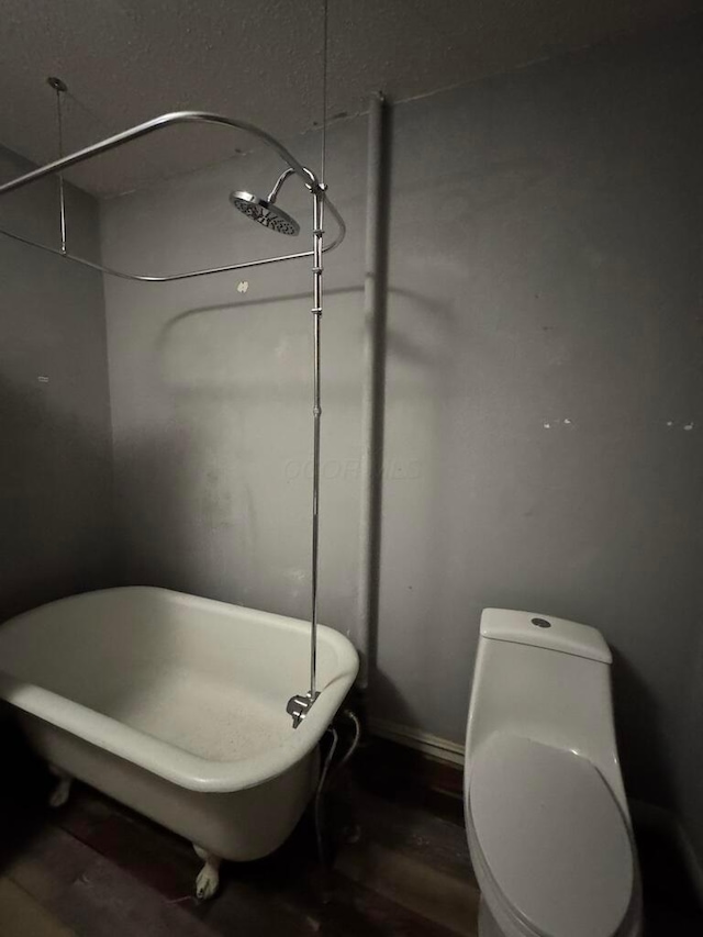 bathroom featuring hardwood / wood-style flooring and a tub