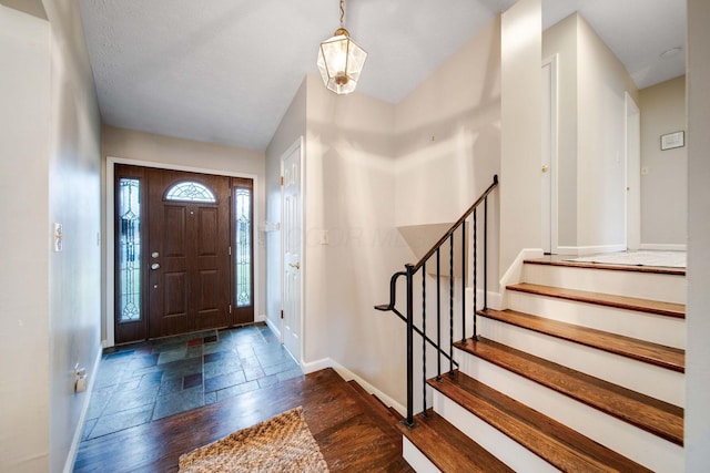 entryway with dark wood-type flooring