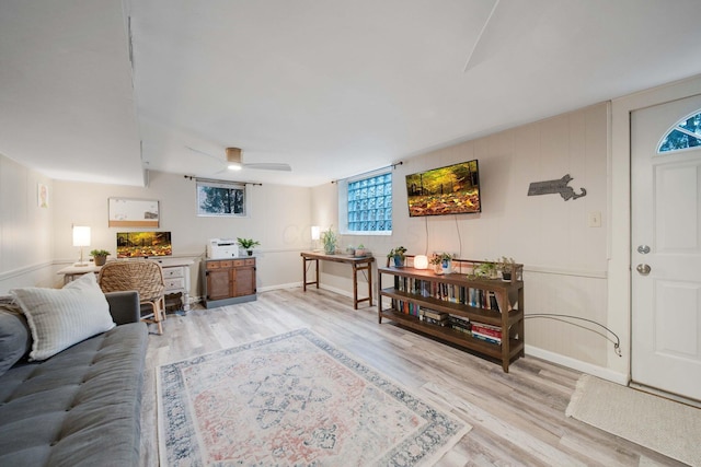 living room featuring hardwood / wood-style flooring and ceiling fan