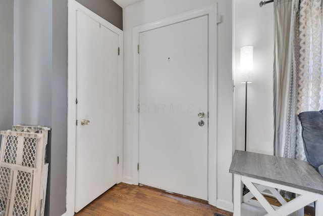 doorway featuring wood finished floors