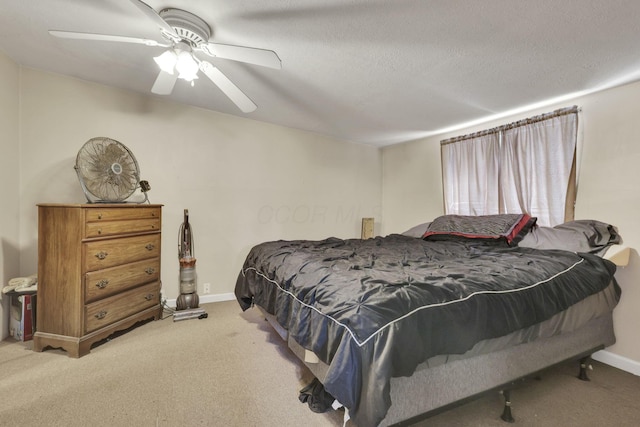 bedroom featuring carpet flooring, ceiling fan, a textured ceiling, and baseboards