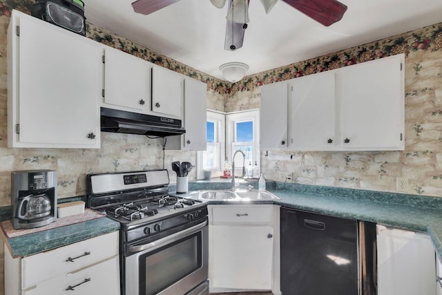 kitchen featuring black dishwasher, white cabinets, a sink, under cabinet range hood, and stainless steel gas range oven