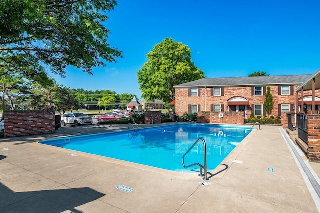 view of swimming pool featuring a patio area