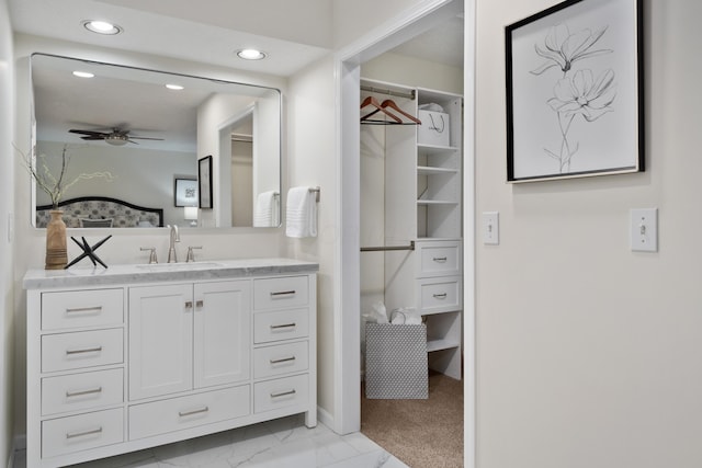 bathroom with ceiling fan and vanity