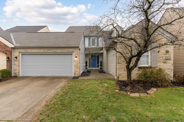 front of property with a garage and a front yard