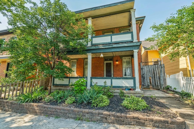 view of front facade with a porch and a balcony