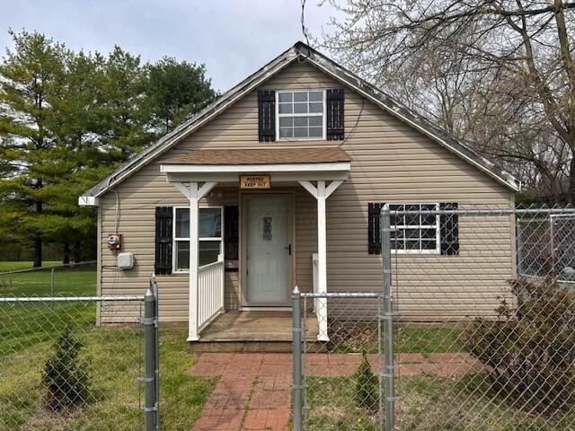 13853 Era Rd, Mount Sterling, OH 43143 - bungalow featuring a front lawn and a fenced front yard