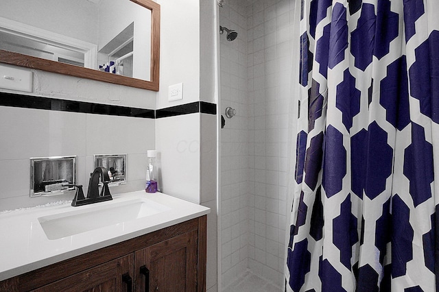 bathroom with vanity and curtained shower