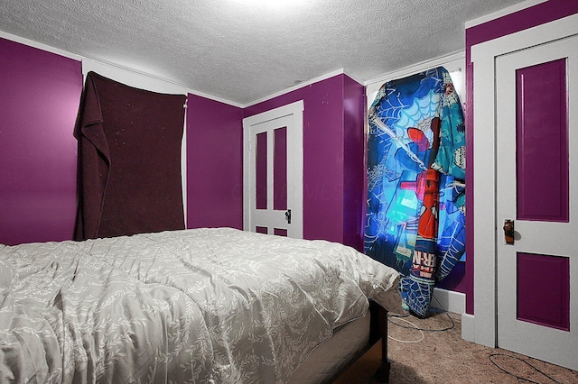 carpeted bedroom featuring a textured ceiling