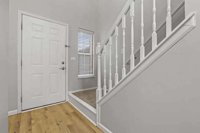 foyer entrance with light hardwood / wood-style floors