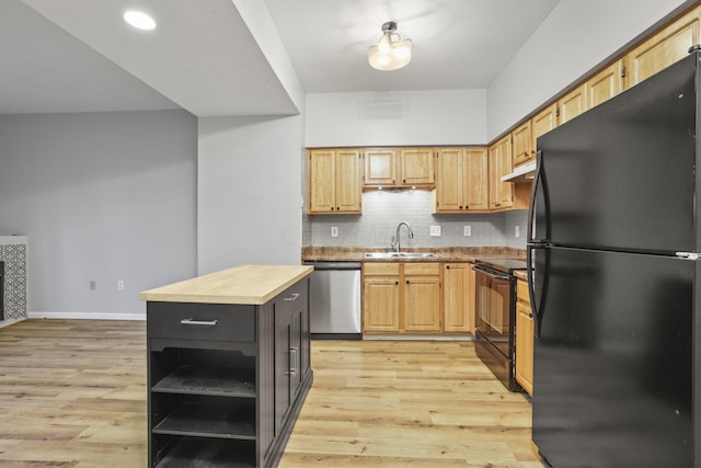 kitchen with light hardwood / wood-style floors, sink, butcher block countertops, and black appliances