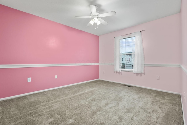 carpeted empty room featuring ceiling fan