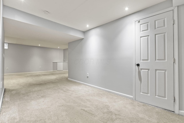 basement with carpet flooring