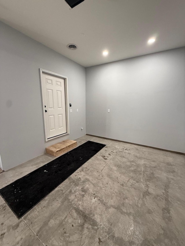 interior space featuring concrete floors, visible vents, and recessed lighting