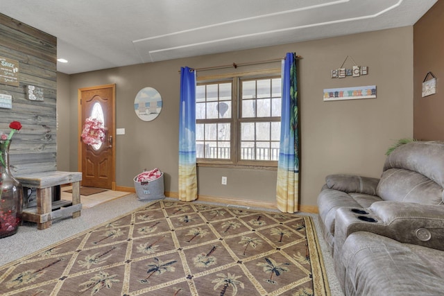 living area featuring baseboards