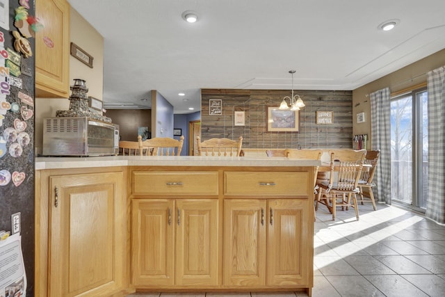 kitchen featuring recessed lighting, light brown cabinets, light countertops, and decorative light fixtures