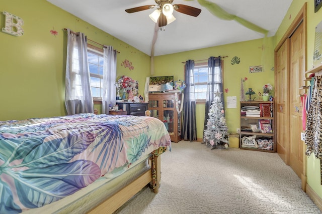 carpeted bedroom featuring a ceiling fan