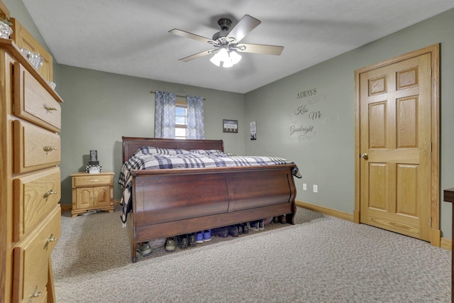 bedroom featuring carpet, ceiling fan, and baseboards