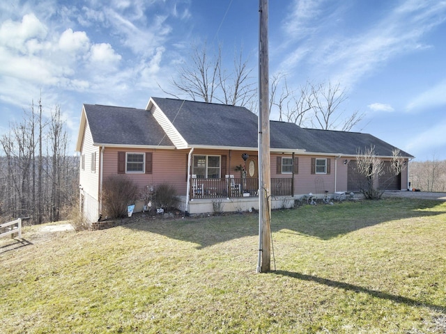 single story home with covered porch, a front yard, and a garage