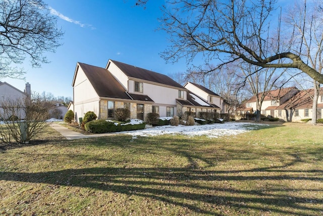 view of side of property featuring a lawn