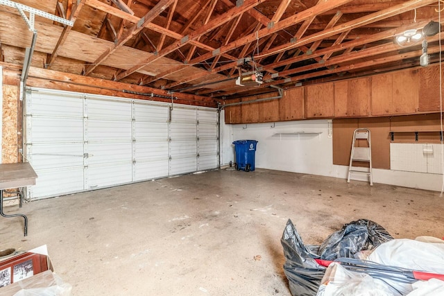 garage featuring a garage door opener