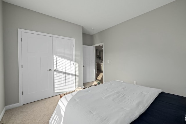 carpeted bedroom featuring a closet