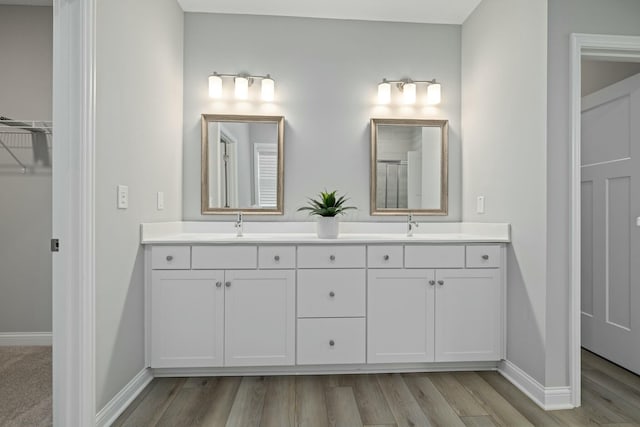 bathroom featuring vanity and hardwood / wood-style floors