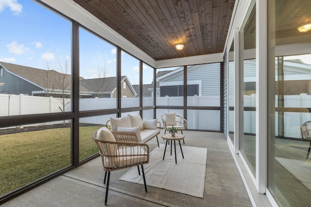 sunroom / solarium featuring wooden ceiling