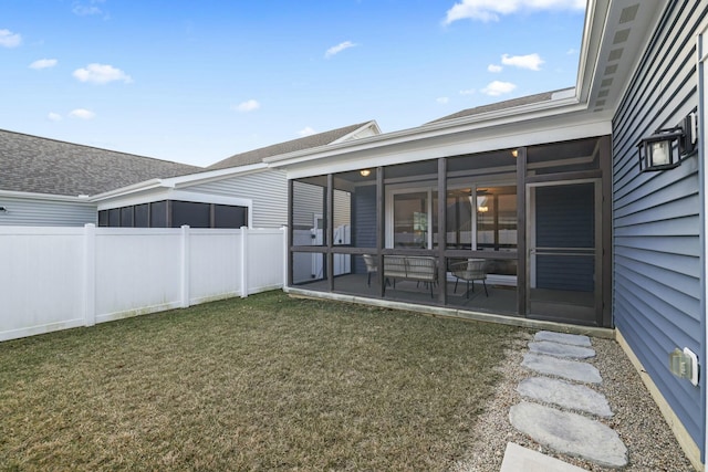 view of yard with a sunroom