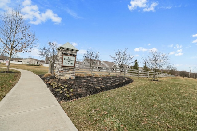 view of home's community with a yard