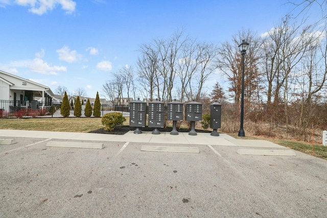 view of parking featuring mail boxes