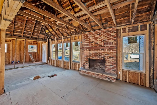 miscellaneous room with a brick fireplace