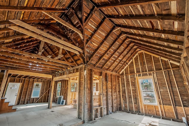 misc room featuring vaulted ceiling and a wealth of natural light