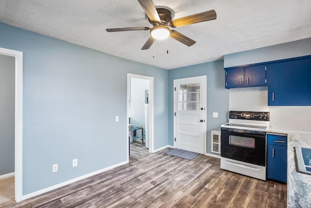 kitchen with dark hardwood / wood-style floors, blue cabinets, ceiling fan, a textured ceiling, and electric stove