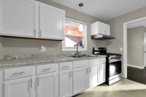 kitchen with white cabinetry, sink, stainless steel range oven, and extractor fan