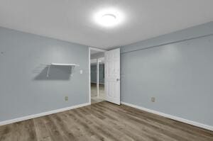 spare room featuring hardwood / wood-style flooring