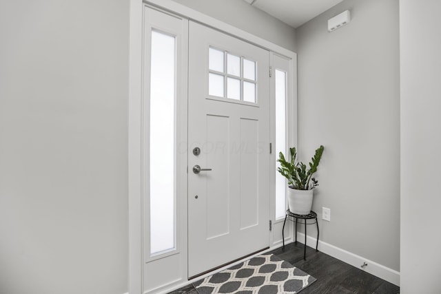 entrance foyer with dark hardwood / wood-style floors