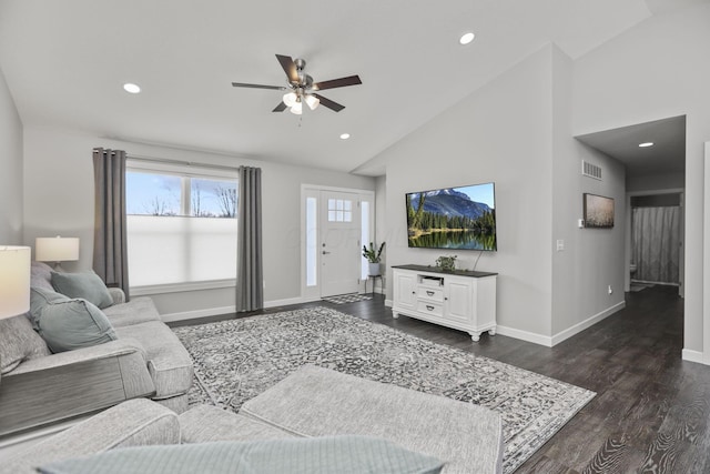 living room with ceiling fan, high vaulted ceiling, and dark hardwood / wood-style flooring