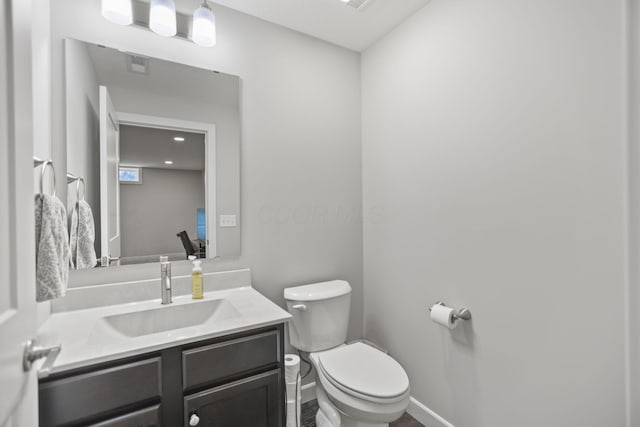 bathroom with vanity and toilet