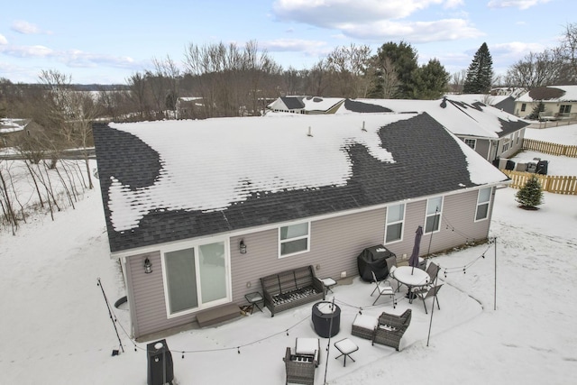 view of snow covered house