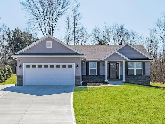 view of front of house with a front lawn, roof with shingles, a garage, stone siding, and driveway