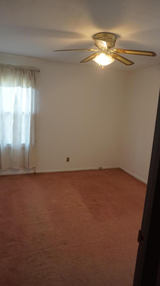 carpeted empty room with ceiling fan